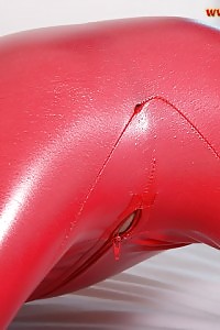 Flawless Leslie Unzips Her Latex Red Costume