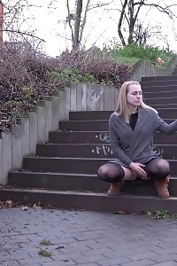 Superb Blonde Pisses Over Steps In The City