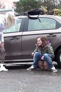2 Gfs Piss Behind A Parked Vehicle
