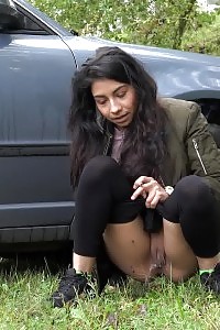 Fascinating Honey Squats Behind Parked Vehicle To Piss