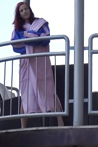 Magnificent Ginger Pisses Over Her Balcony