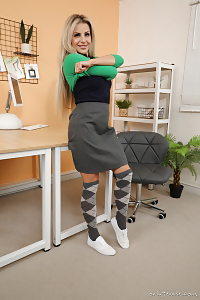 Chloe Welsh Poses Confidently, Flaunting Her Enviable Great Ass Wrapped In Coloral Shorts And Sheer Pantyhose