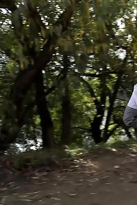 Brunette Lass Keeps A Lookout While Peeing