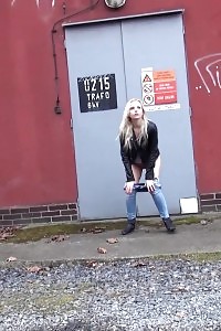 Outstanding Light-haired Squats On Concrete To Pee