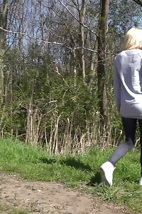 Light-haired In Jeggings Pisses On A Dirt Track