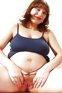 Awesome Pregnant Having Fun With Her Eating Tits And Good Rounded Stomach Before Stretching Her Gap