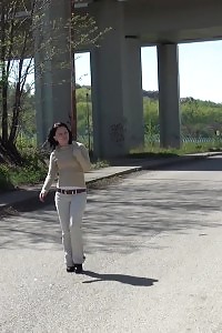 Magnificent Dark Haired Babe Sprays Her Pee Onto Steps