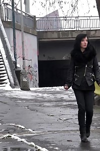 Good-looking Black Haired Babe Melts Snow As She Pissing