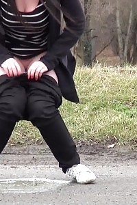 Strong Brunette Pisses In The Mid Of The City