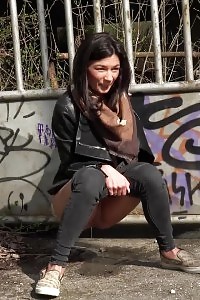 City Peeing For Seductive Black Haired Chick