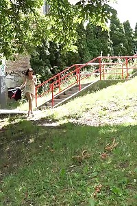 Dark Haired Lady Squats On A Wooden Bench To Piss